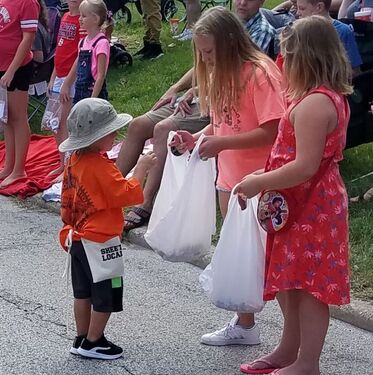 Picture of Honorary Local 1 Member Miller distributing candy at the Labor Day Parade