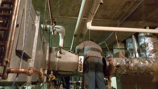 Picture of Sheet Metal Worker LU#1 installing ductwork